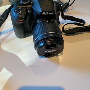 Nikon D3400 DSLR Camera in Black with Black Lens Cap